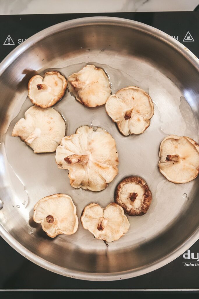 Searing shiitake mushrooms. 