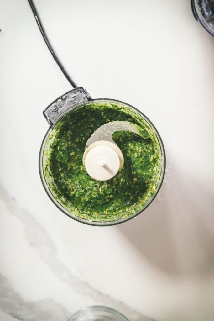 Pulsing until the pesto is at the right consistency. 