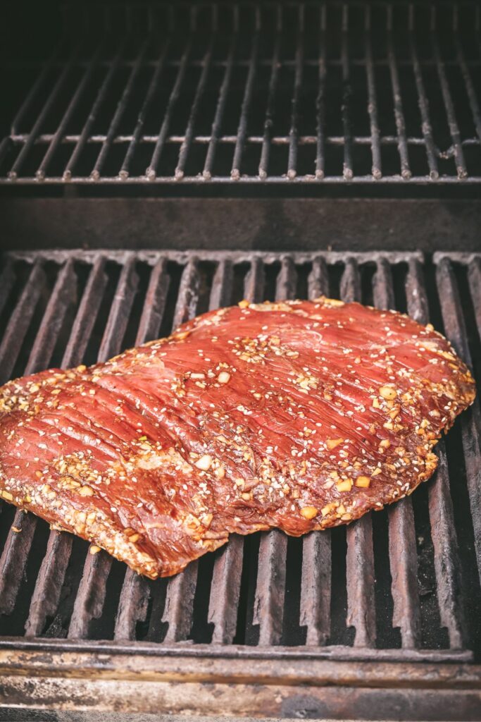 The steak on the grill.