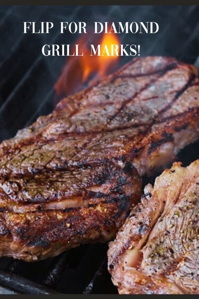 Steaks flipped with grill marks.