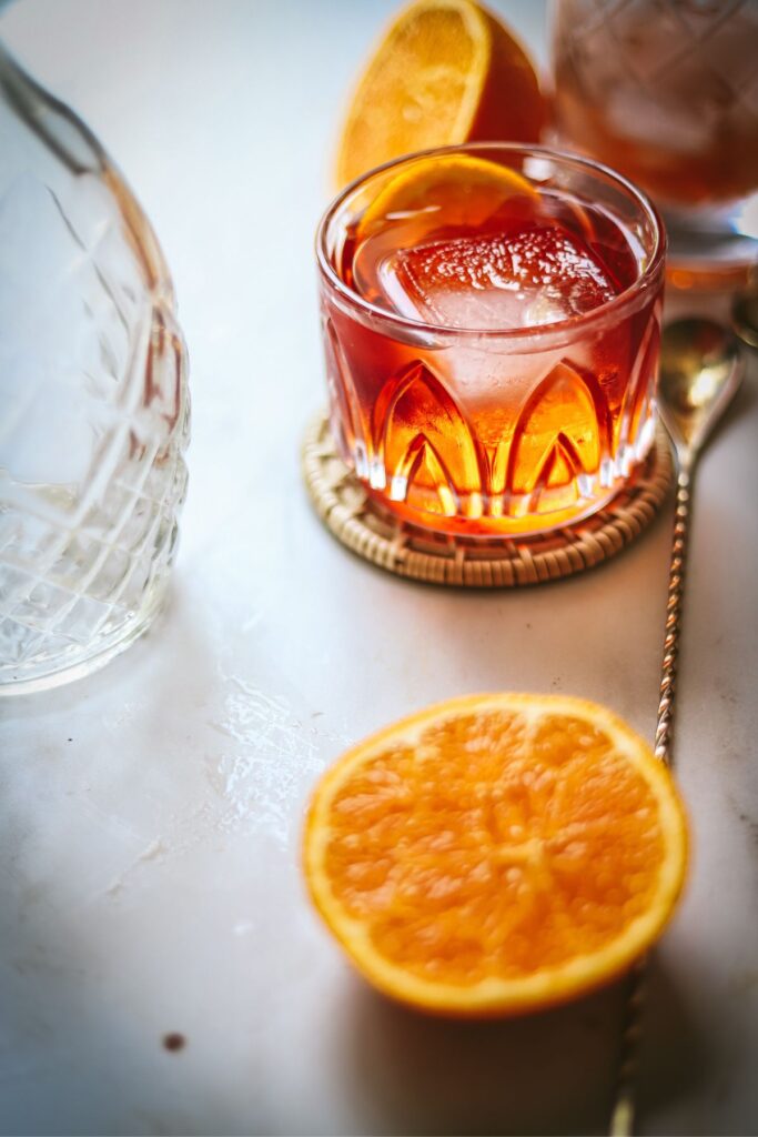 An aperol negroni with citrus slices. 