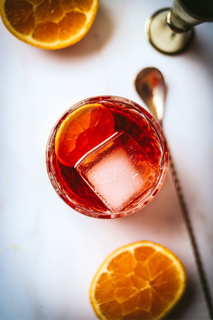A negroni with aperol, with a bar spoon. 