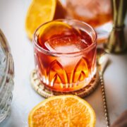 An aperol negroni with barware.