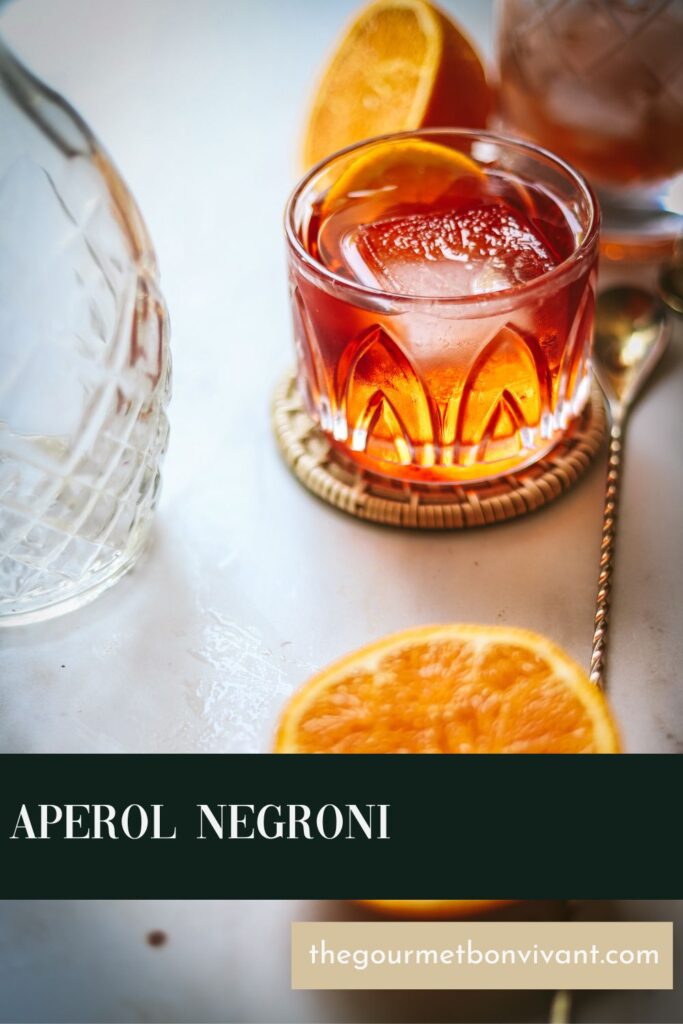 An aperol negroni cocktail with title text.