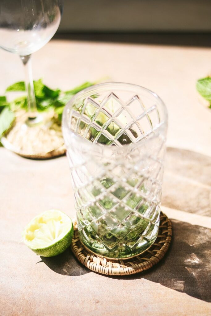 Mint and lime juice in a shaker. 