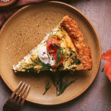 Salmon and spinach quiche with smoked salmon on the side.