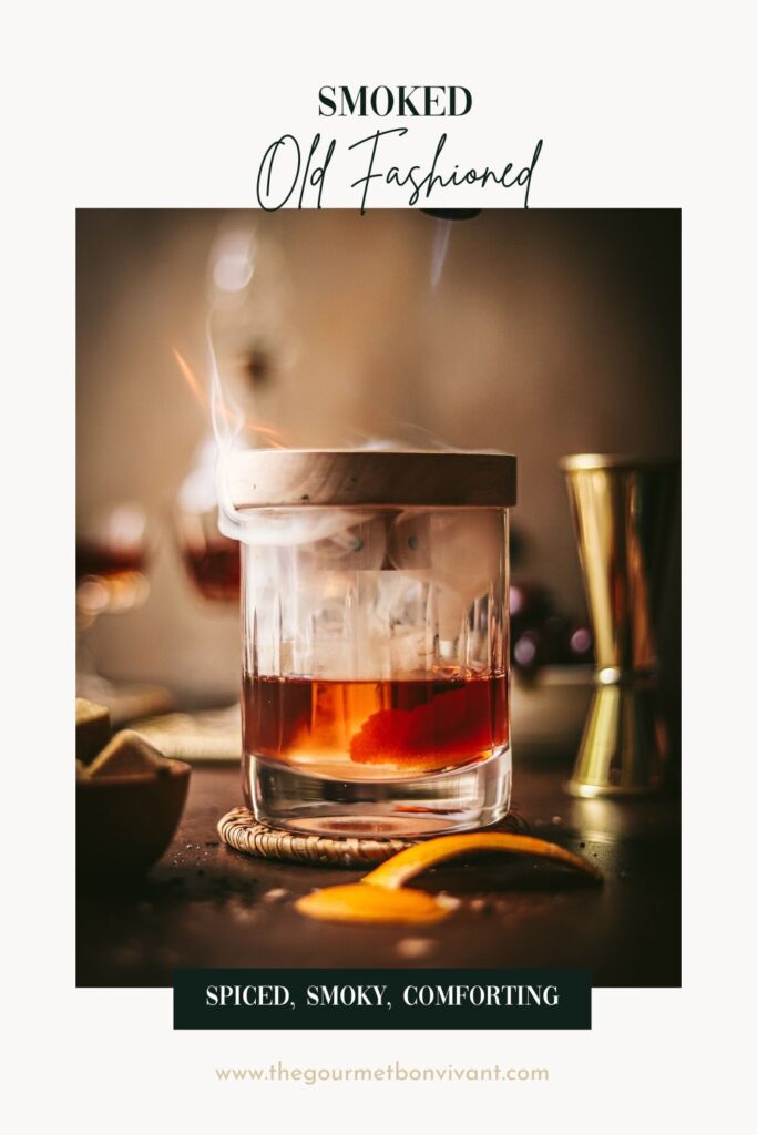 A smoked old fashioned with title text.