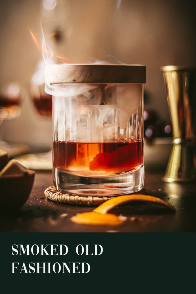A smoked old fashioned with title text.