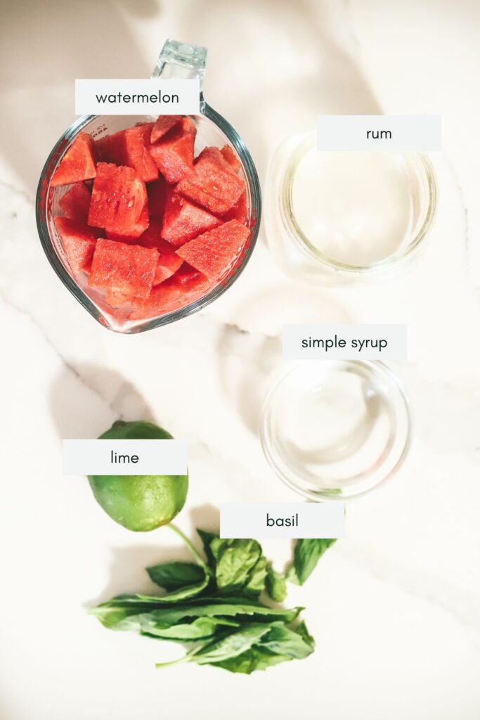 The ingredients for a watermelon basil vodka cocktail. 