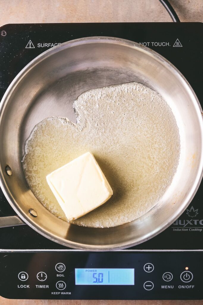 Melting butter in a pan. 
