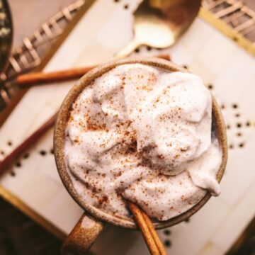 A maple latte with cinnamon whipped cream.