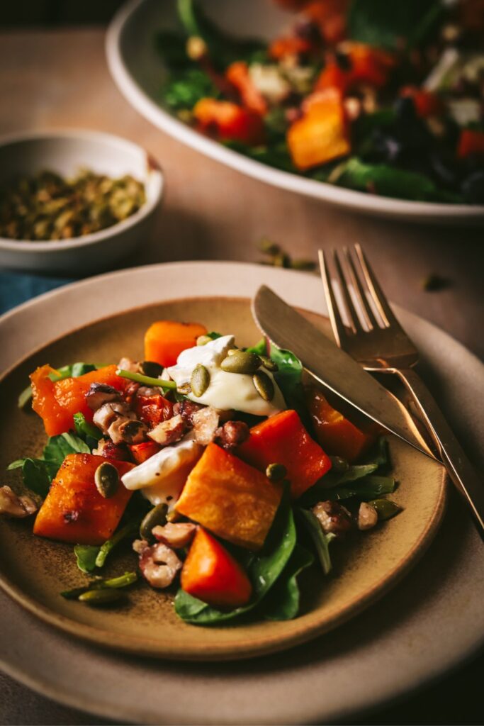 A small plate of butternut squash salad. 