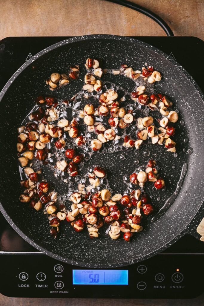 Hazelnuts and sugar in a pan. 