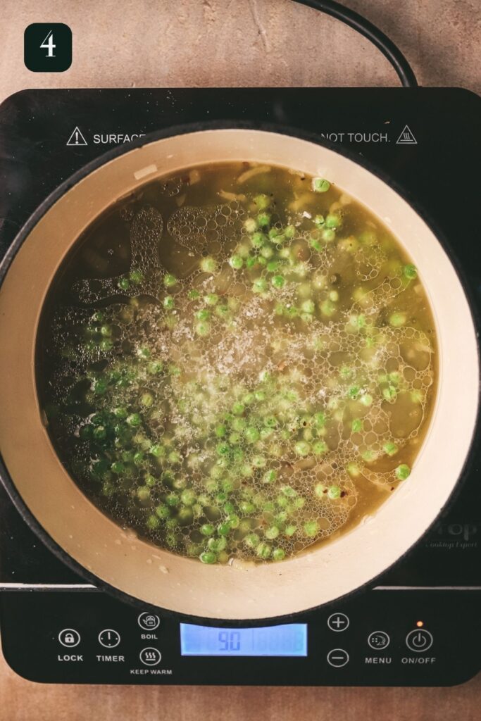 Adding the chicken broth, salt and pepper. 