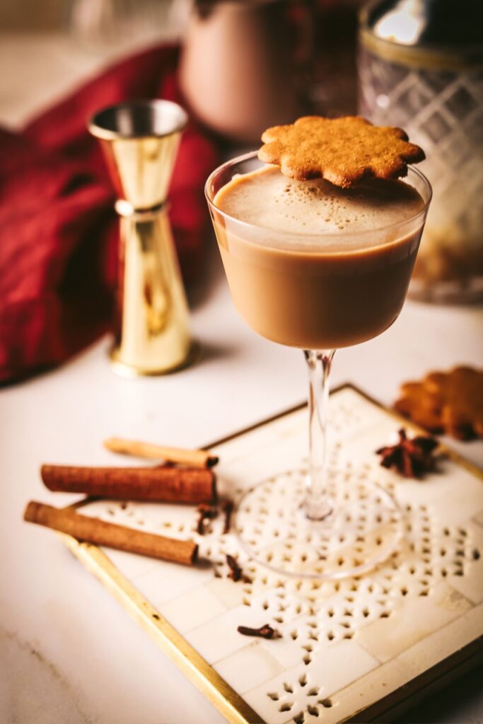 A gingerbread martini with a cookie.