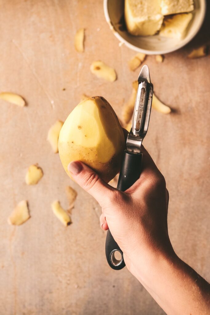 Peeling potatoes. 