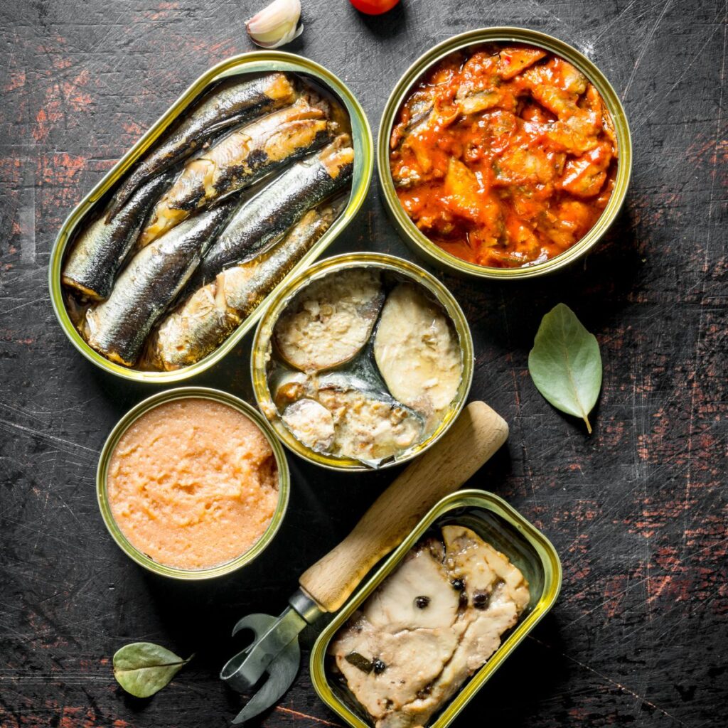 A variety of canned fish, still in the can.