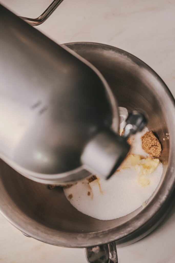 Butter and sugars in a stand mixer. 