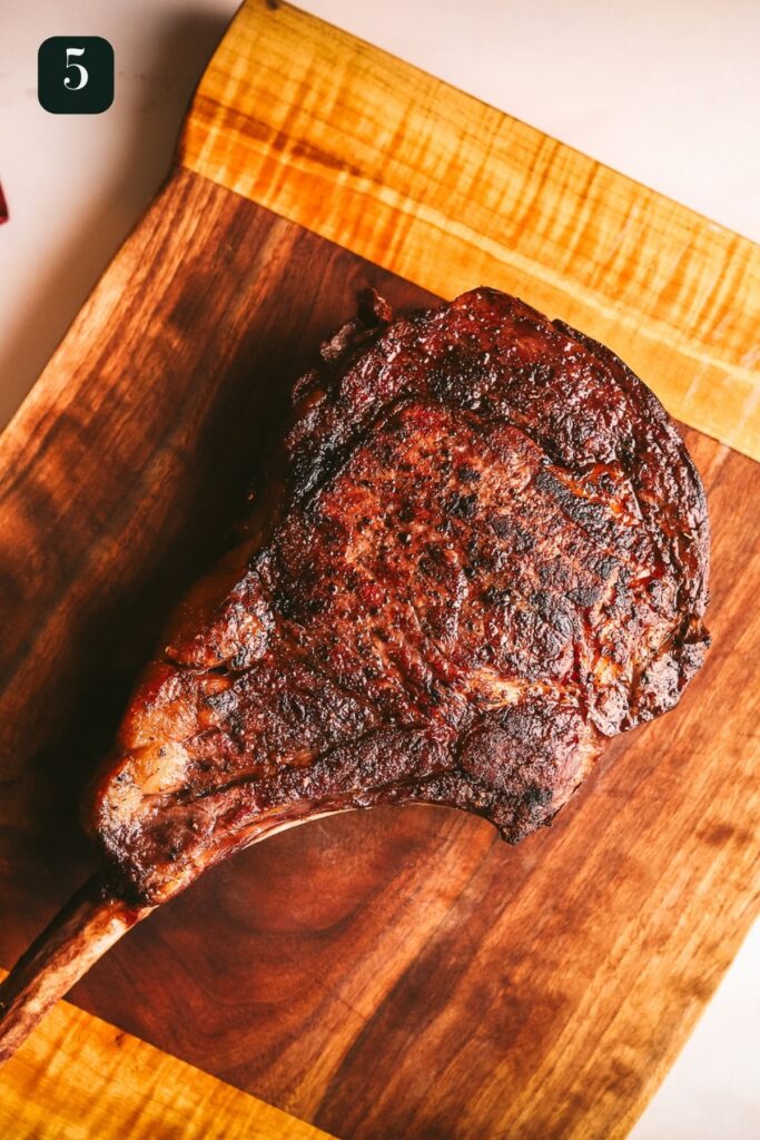 The tomahawk on the serving board. 