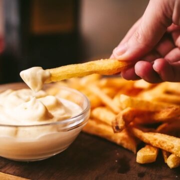 Dipping fries in aioli.