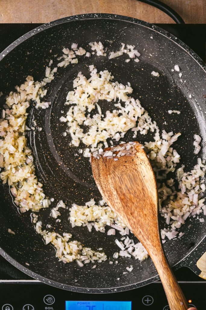 Cooking shallots in the same pan that the mushrooms were cooked in. 