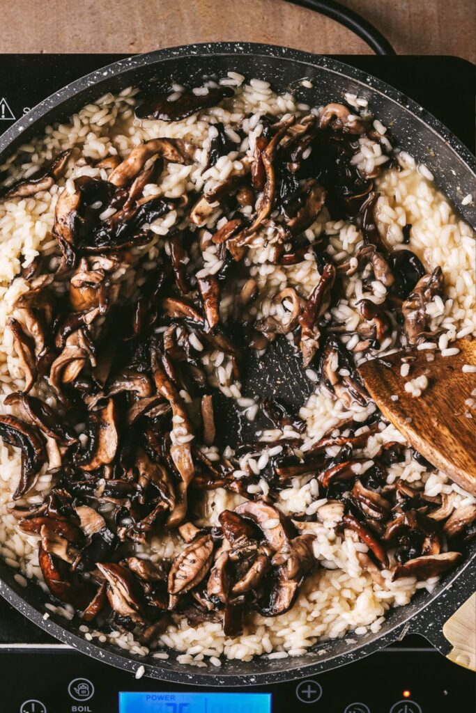 Adding the cooked mushrooms. 