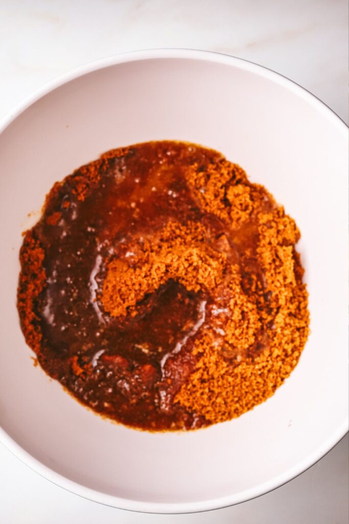 Butter and cookie crumbs in a mixing bowl. 